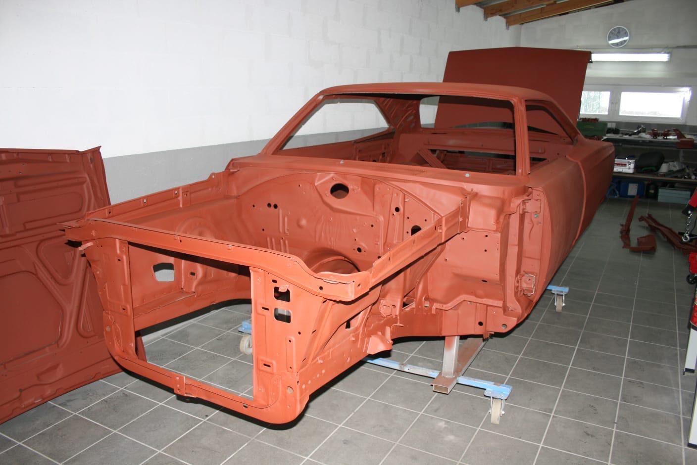 Bare shell in epoxy primer on the rotisserie